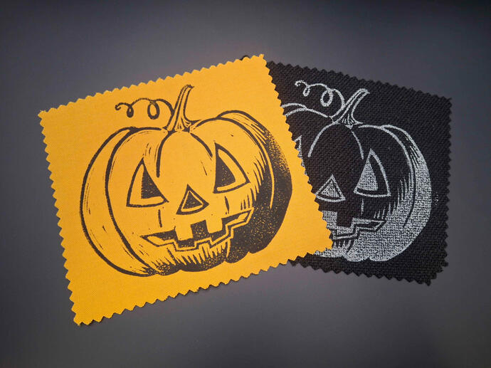 Block printed patches of a Jack o' Lantern.