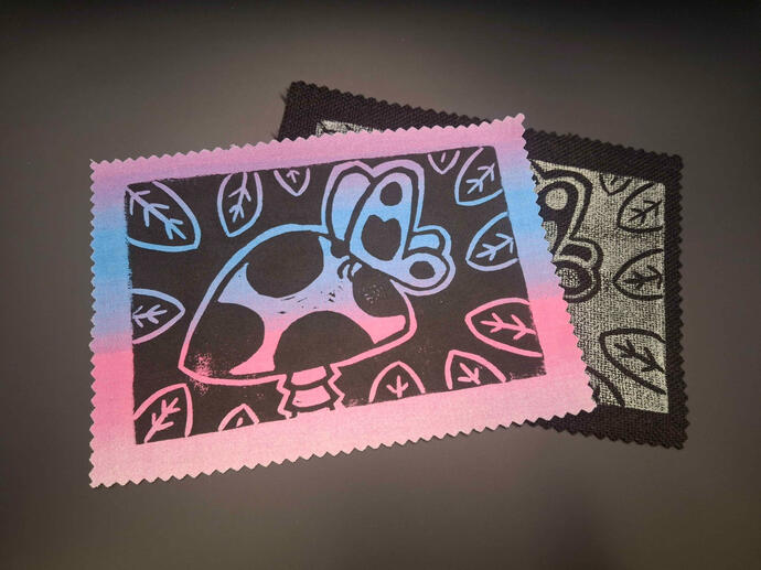 Block printed patches of a butterfly landed on a mushroom cap.